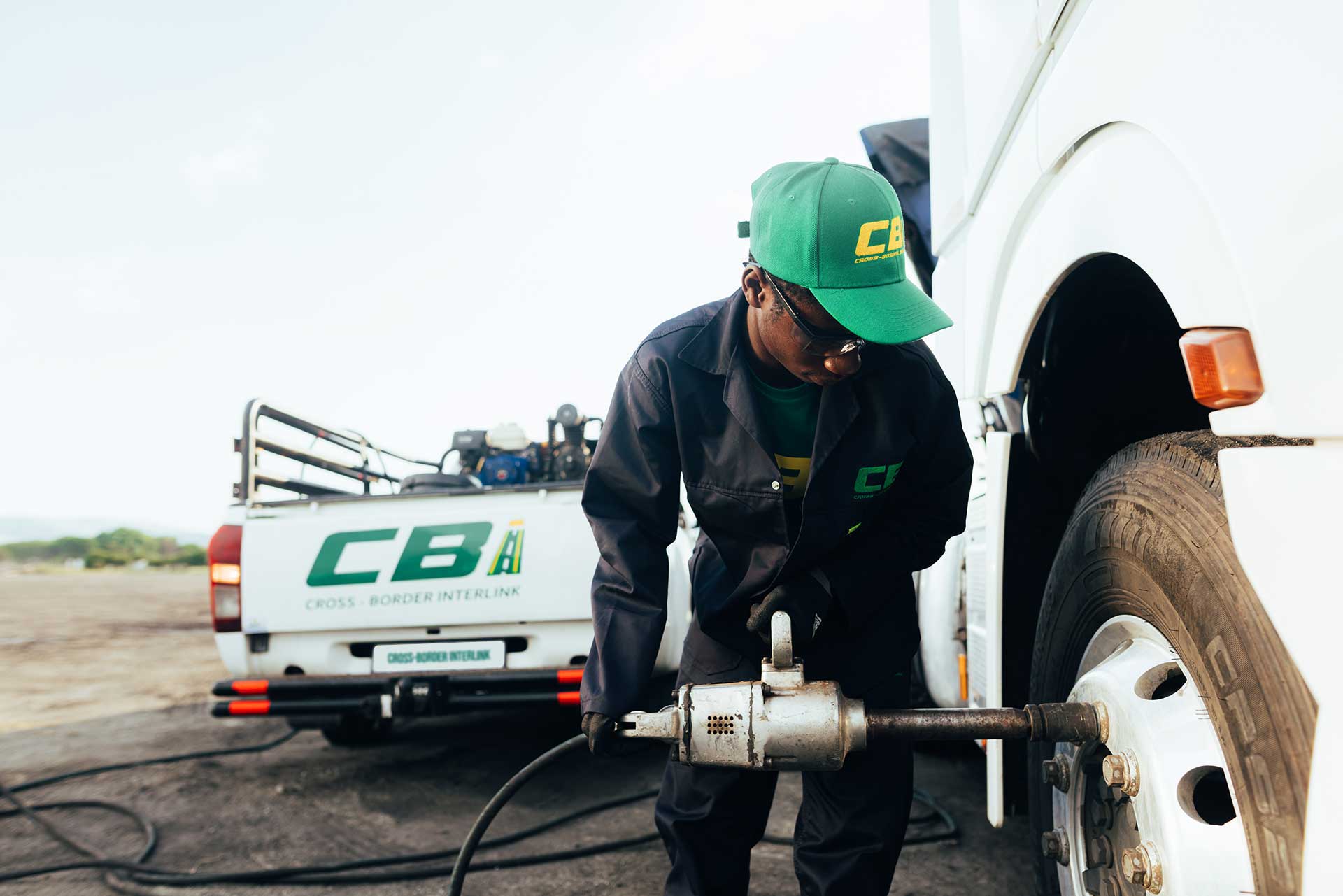 Field technician changing a truck tyre